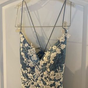 Beautifully colored glittery prom dress with brocade florals